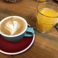 Cappuccino with oat milk and orange juice  at Brunch Corner in Valencia