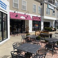 Exterior with Pride flags at Nirvana Tea House & Cafe in Millis
