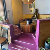 Indoor seating area at Nirvana Tea House & Cafe in Millis