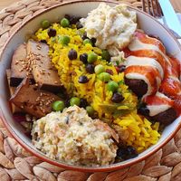 Bowl with smoked tofu, falafels, tasty rice, 2 sauces (zuchini and eggplants) and salad underneath. AMAZING !!!! at Pisekar Vegan Food in Antalya