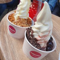 Soy froyo with biscoff cookie crumbs and nuts (peanuts) & the other one with cherries and dark chocolate at Moochie in Ghent