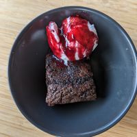 Brownie with coconut ice cream and berry sauce at The Cider House in Vancouver