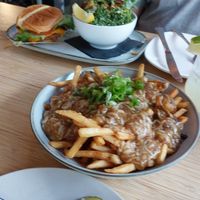 Poutine and Burger in the back at The Cider House in Vancouver