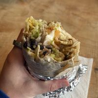Vegan deluxe burrito (half-eaten) 😂  at Hey Juan Burritos in Arcata
