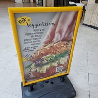 Front sign for 'veggie' /vega options (not vegan) at Panos in Brussels