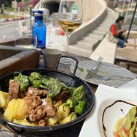 Vegan chorizo plate with padron peppers and roasted potato 10/10  at La Odisea in Malaga
