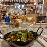 Vegan chorizo with potatoes and green peppers. Vegan wine. at La Odisea in Malaga