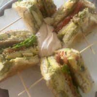 Club sandwich vegano con pesto di basilico e tofu affumicato   at Oasis Cafè in Treviso