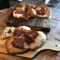 Vegan bread with tomato and olive tapenade, polenta doughnuts  at Gantley's Tavern in Queenstown