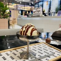 salted cashew ice cream with caramel sauce and nuts   at MYLK in Doha