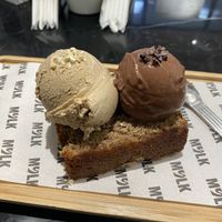 Banana bread with salted cashew and dark choc ice cream   at MYLK in Doha