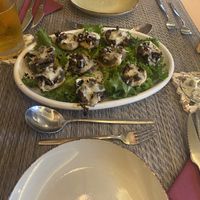 stuffed mushrooms with vegan cheese and tomatoes  at Gavino Restaurante Bar in Funchal
