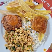 Rice , beans, banana chips, patty and something at Ananda in Managua