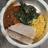 Vegan plate: Misir Wot (spiced red lentils), Gomen w/ Dinich (seasoned spinach), Kik Alicha (yellow split peas)  at Konjo Ethiopian Food in Edgewater