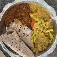 Vegan plate: Misir Wot (spiced red lentils), Kik Alicha (yellow split peas), and Tikel Gomen (curried cabbage)  at Konjo Ethiopian Food in Edgewater