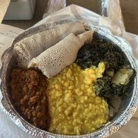 Vegan plate with red (spicy) lentils, yellow split lentils, spinach and potato’s with 2 rolls of injera.  at Konjo Ethiopian Food in Edgewater