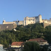 Stieglkeller: direct beneath the Castle: the building with the red roof; the terraces are on the left with the trees. at Stiegl-Keller in Salzburg