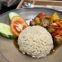 Vegan stir fried soy chicken in organic black pepper on rice, 129 baht  at VIBE Coffee & Plant-Based Food in Bangkok