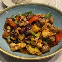 Vegan sautéed plant chicken with cashews in aroma chilli oil (169 baht) with brown rice (45 baht)  at VIBE Coffee & Plant-Based Food in Bangkok