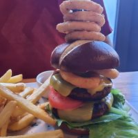 Double vegan burger with onion rings at Daisy's  in Torquay