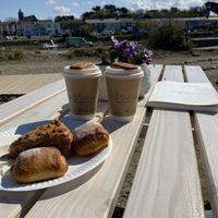 Salted caramel lattes, vegan Pain au Chocolat & Ginger Biscoff cake - yummy!!! Topped with lovely views   at Be Kind The Vegan Coffee Caravan in Hayle
