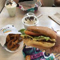 traditional v burger, onion rings and mint choc milkshake  at V Burger in Calgary