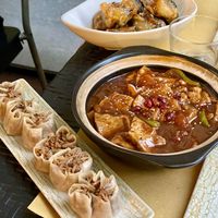 Open dumplings, tofu in tomato sauce, fried aubergine with tofu   at Su Guan in Florence