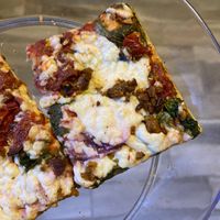 Ordered a ‘16 pizza with vegan cheese and sausage. I also added sun-dried tomatoes, garlic, and spinach (chef’s kiss 😚). Thanks for making an awesome pie, Puccini’s!!  at Puccini's Pizza & Pasta - Greenbriar in Indianapolis