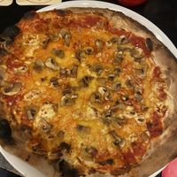 Pizza funghi with vegan cheese   at Happy Italy in Eindhoven
