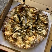Pizza of Champignons w/ vegan bacon at Oregano Pizzeria in Worthing