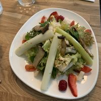 Asparagus salad with strawberries and mushrooms with raspberry vinaigrette (bread included)  at Velani in Vienna