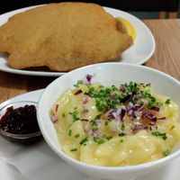 Traditional potato salad with lingonberry jam for the schnitzel at Velani in Vienna