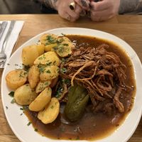 Seitan with onion roast and baked potatos  at Velani in Vienna