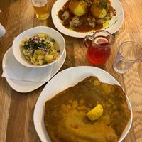 Wiener Schnitzel mit Erdäpfelsalat und Grammelknödel mit Sauerkraut  at Velani in Vienna
