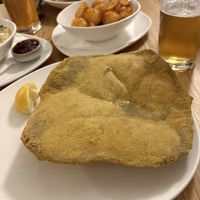 Schnitzel plus roast potatoes  at Velani in Vienna