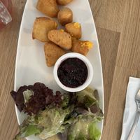 Backkäse mit Preiselbeersoße  at Velani in Vienna