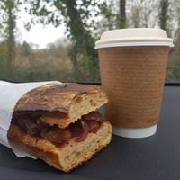 Vegan sausage and caramelised onion ciabatta and oat latte at Happyccino in Wimborne