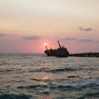 Ghostly shipwreck by sunset at Oniro By The Sea in Paphos