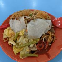 To reduce the water usage to clean the plate. Put all the side dishes on same plate. at Yi Sheng 益生素食 - Mountbatten in Central Singapore