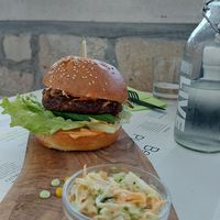 Biomania burger with a bit dry patty at BioMania Bistro Bol in Bol