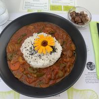 Red curry with side of smoked tofu  at BioMania Bistro Bol in Bol