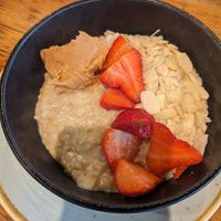 Porridge with soy milk, peanut butter, strawberries and almonds at Olive & Bean in Newcastle Upon Tyne