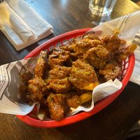 Currywurst - Fries & Beyond sausage with a ketchup curry sauce on top (Can get mild, medium, hot) at Shepherd's Pub in Elora