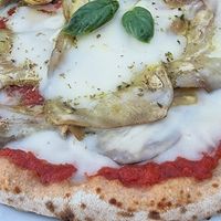 Pizza parmigiana at Paradiso Pizzeria Gelateria in Trequanda