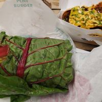 Spicy Chik'n Funguy burger in a swiss chard wrap and Chili N' Cheese Sausage at PLNT Burger in Wynnewood