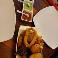 Vegetable pakora with dipping sauce, the middle green one is NOT vegan! at Namaste in Ljubljana