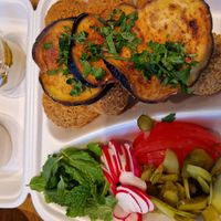 Falafel dinner with hummus and tahini. Pickles, tomato, radish, mint and aubergine. at King Falafel in Oslo