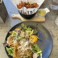 seitan salad and sweet potatoe fries  at Vorstid & Vahvlid in Parnu