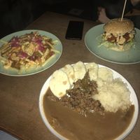 burger, fries and a traditional dish  at Shromaždiště in Prague