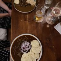 Vŷpečky (slow roasted soy chunks in gravy with cabbage - top) and guláš (bottom)  at Shromaždiště in Prague
